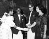 With an unidentified couple